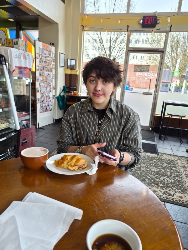 Clair Moon at a cafe table